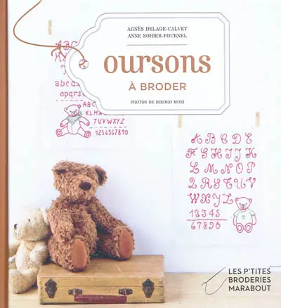 Ours : motifs de broderie traditionnelle et au point de croix